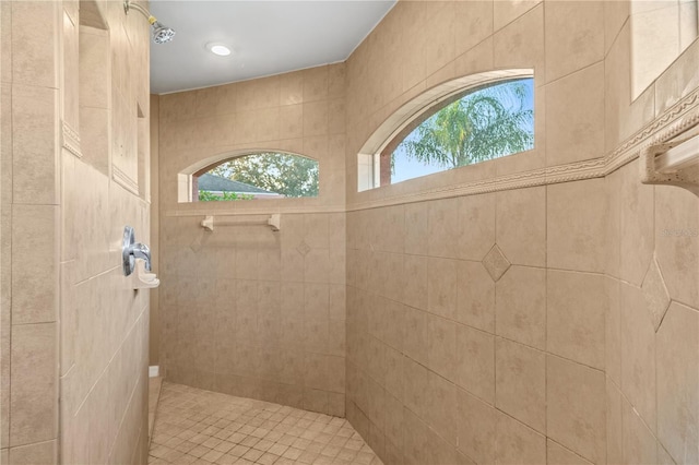 bathroom with a tile shower