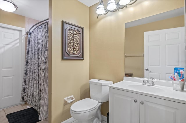 bathroom with toilet, curtained shower, vanity, and tile patterned flooring