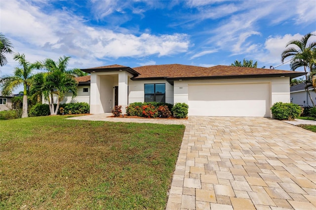 view of front facade featuring a front yard and a garage