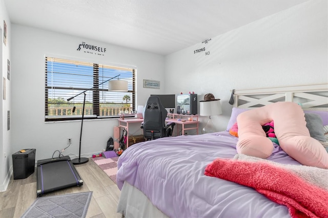 bedroom with light wood-type flooring