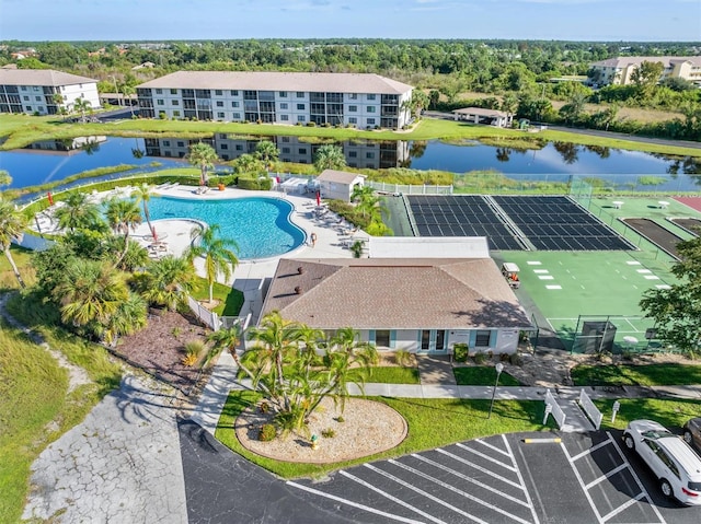 birds eye view of property with a water view