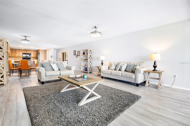 living room with light hardwood / wood-style flooring