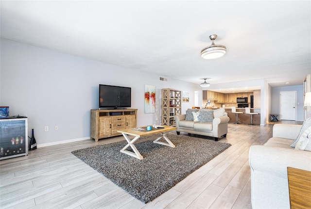 living room with light hardwood / wood-style floors