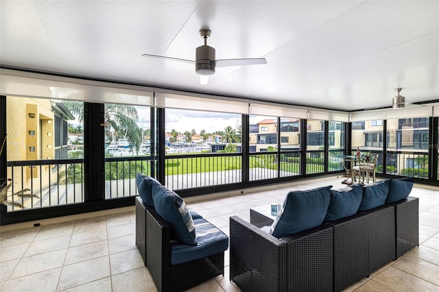 sunroom / solarium with ceiling fan