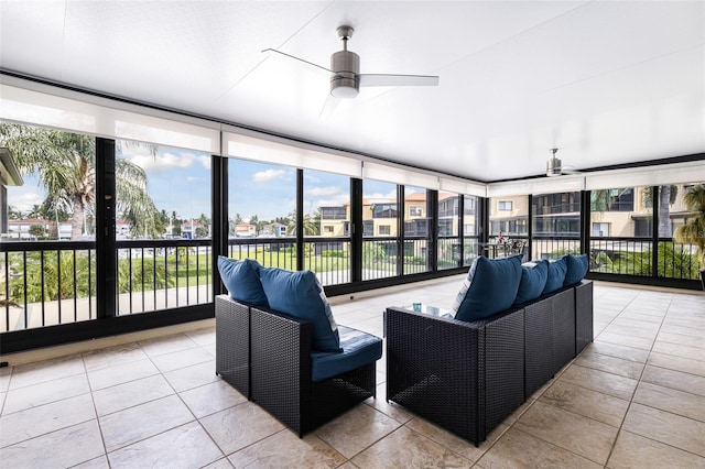 sunroom with ceiling fan