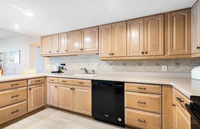 kitchen with black appliances, kitchen peninsula, backsplash, and sink