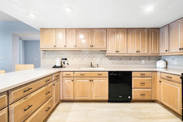 kitchen featuring sink, kitchen peninsula, backsplash, light brown cabinetry, and black dishwasher