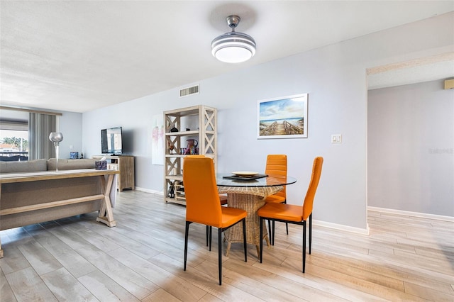 dining room featuring light hardwood / wood-style floors