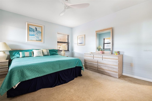 carpeted bedroom with ceiling fan and multiple windows