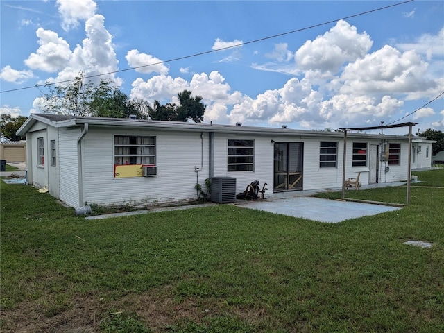 back of house featuring a patio, a yard, and cooling unit