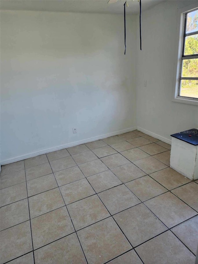 unfurnished dining area featuring light tile patterned floors