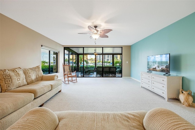 carpeted living room featuring a healthy amount of sunlight and ceiling fan