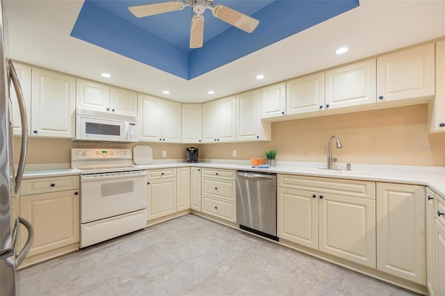 kitchen with ceiling fan, appliances with stainless steel finishes, and sink