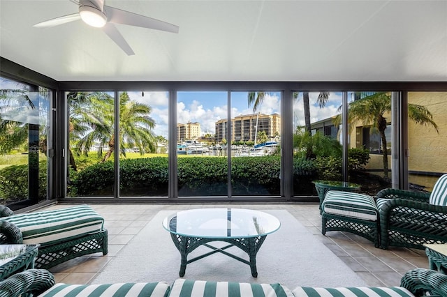 sunroom / solarium featuring ceiling fan