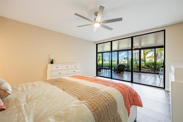 bedroom with access to outside and ceiling fan