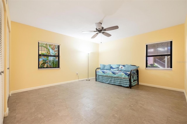 living area featuring ceiling fan