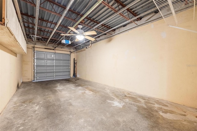 garage featuring a garage door opener and ceiling fan