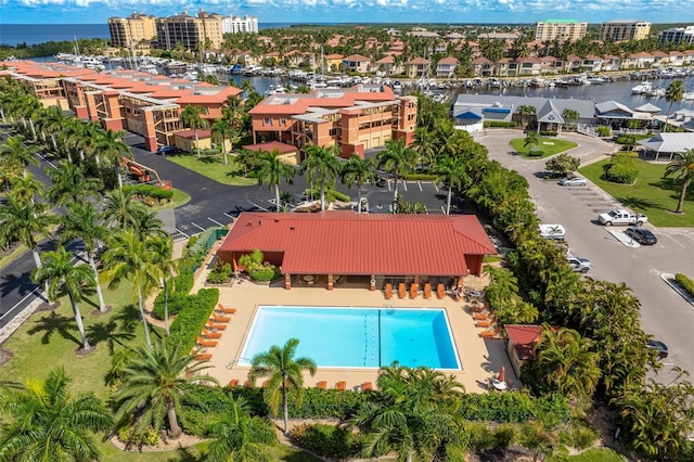 birds eye view of property with a water view