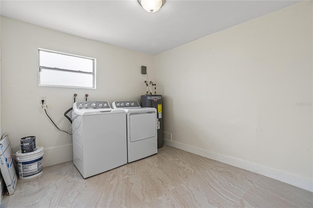 laundry room with water heater and washing machine and clothes dryer