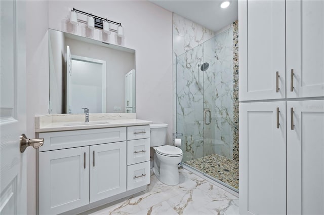 bathroom featuring vanity, toilet, and an enclosed shower