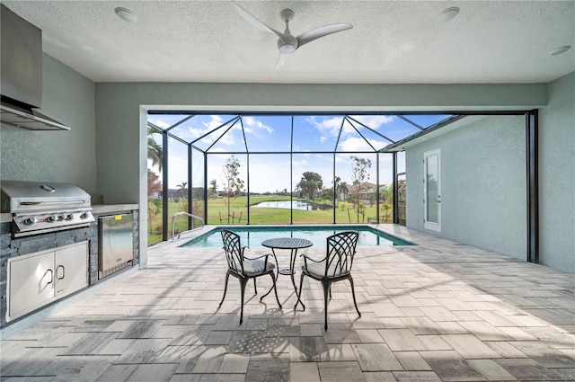 view of pool featuring area for grilling, ceiling fan, a lanai, and a patio