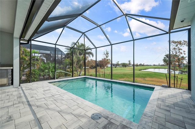 view of pool featuring a patio, a lanai, a yard, and a water view