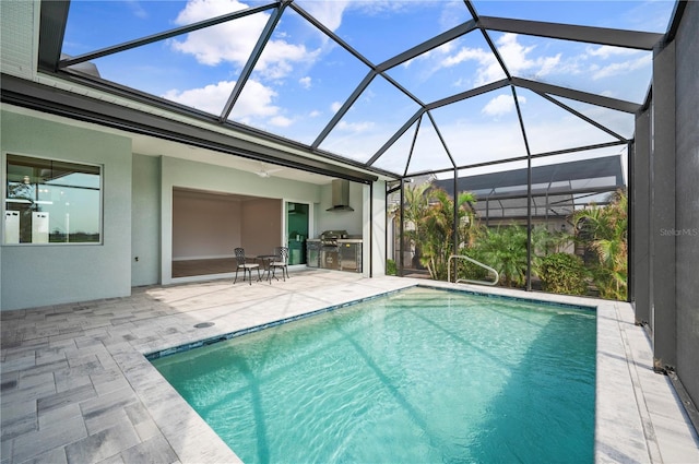 view of swimming pool with area for grilling, a patio area, and glass enclosure