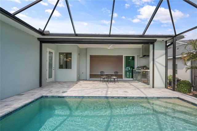 view of swimming pool featuring area for grilling, a patio area, a lanai, and ceiling fan