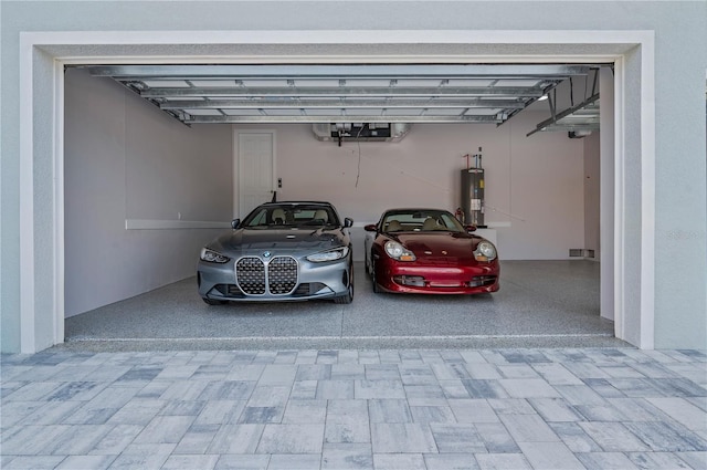 garage featuring a carport and water heater