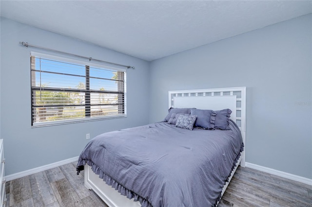 bedroom featuring hardwood / wood-style flooring