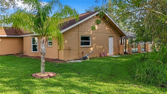 view of side of home featuring a yard