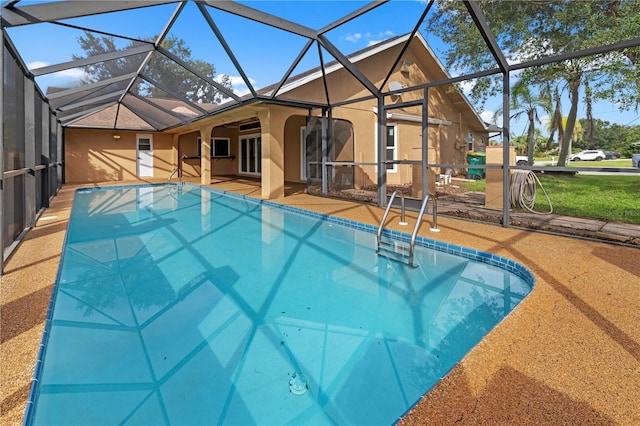 outdoor pool featuring a patio and a lanai