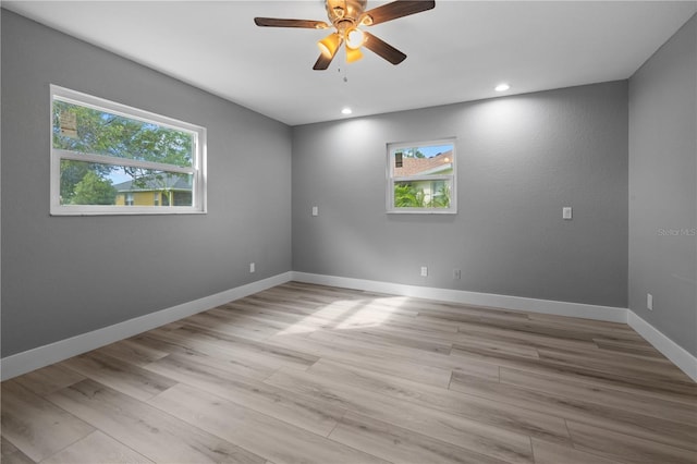 spare room featuring ceiling fan and light wood-type flooring