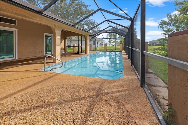 view of swimming pool with a lanai and a patio area