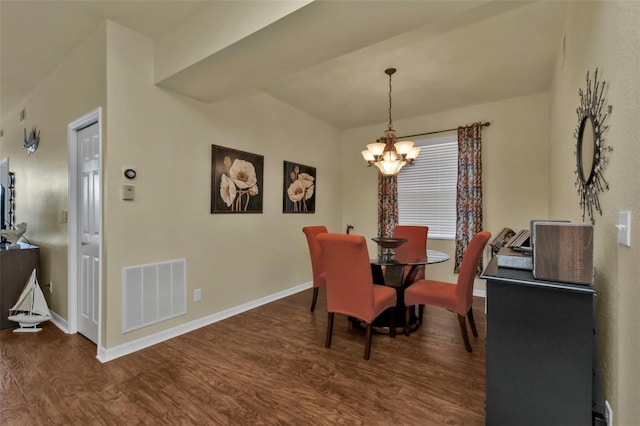 dining area featuring a notable chandelier and dark hardwood / wood-style flooring