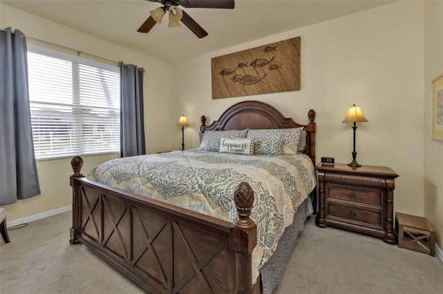 bedroom with light carpet and ceiling fan