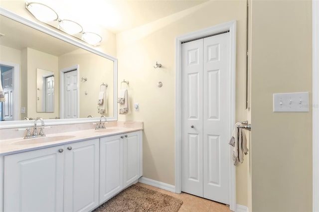 bathroom with tile patterned flooring and vanity