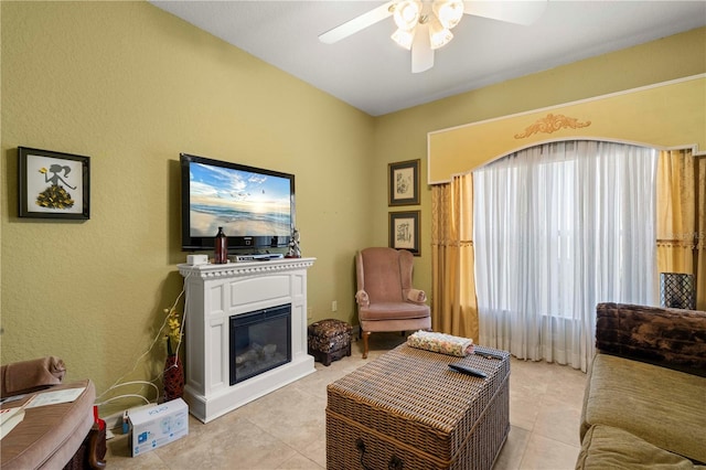 living room featuring ceiling fan, plenty of natural light, and light tile patterned floors