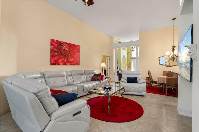 tiled living room featuring a notable chandelier