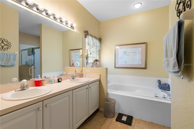 bathroom featuring vanity, plus walk in shower, and tile patterned flooring