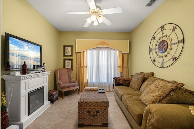 tiled living room featuring ceiling fan