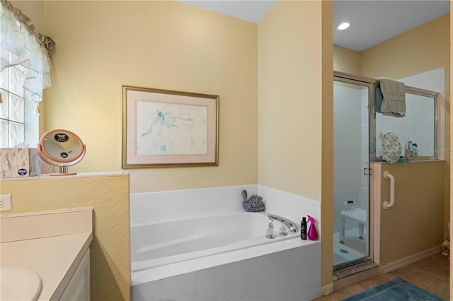 bathroom with independent shower and bath, vanity, and tile patterned floors