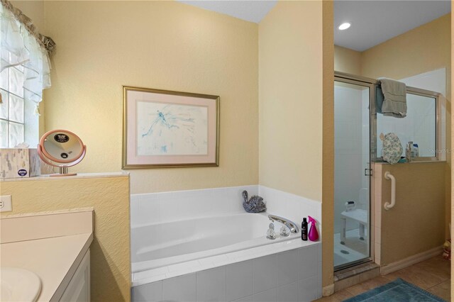1676 Palace Ct, Punta Gorda, FL 33980 - bathroom featuring a bath, a shower stall, vanity, and tile patterned floors