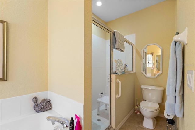 bathroom with shower with separate bathtub, toilet, and tile patterned floors