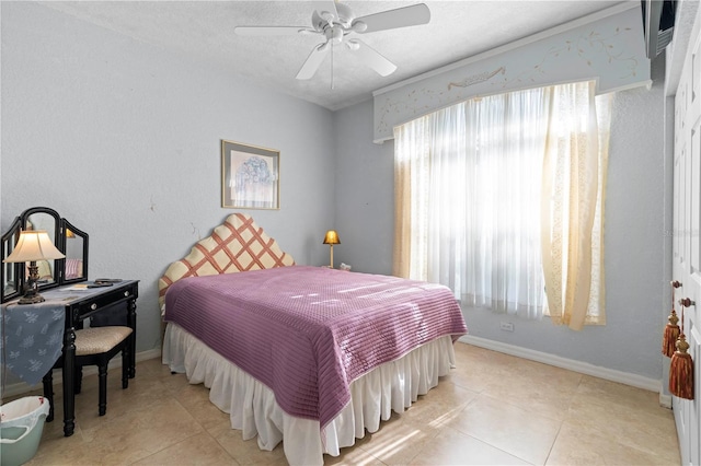 1676 Palace Ct, Punta Gorda, FL 33980 - tiled bedroom featuring multiple windows, baseboards, and ceiling fan