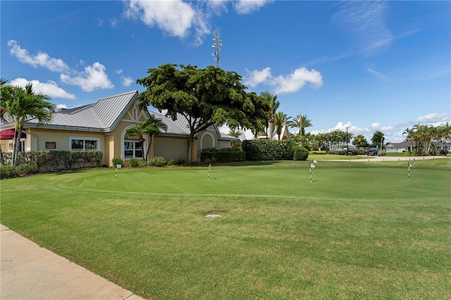 surrounding community featuring a lawn