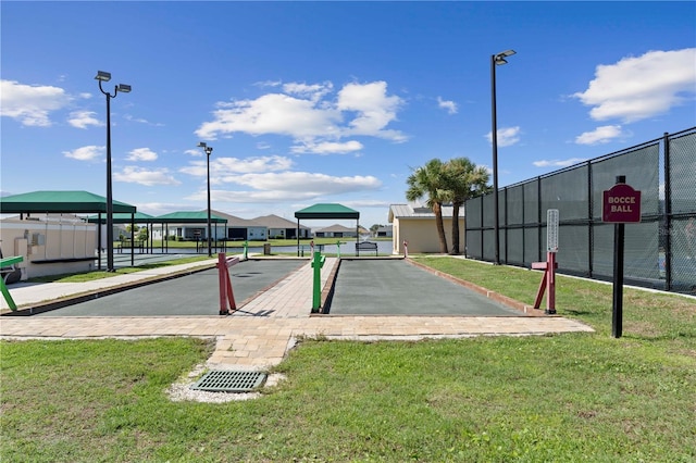 view of property's community with a yard