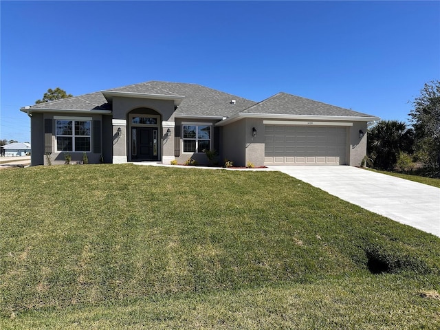 view of front of property with an attached garage, a shingled roof, driveway, stucco siding, and a front yard