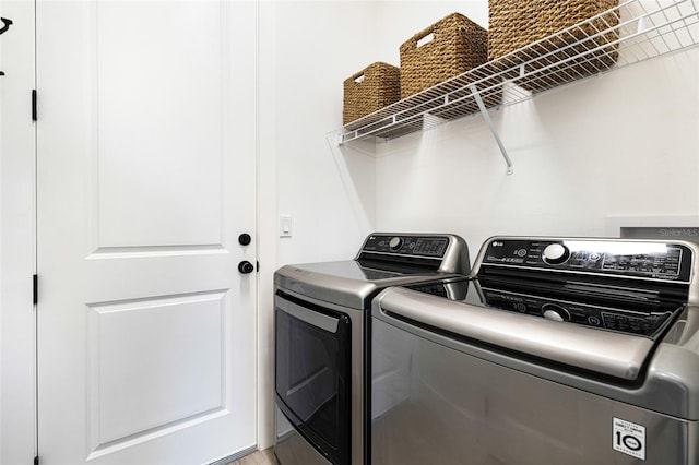 laundry room featuring washing machine and dryer