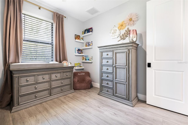 bedroom with light wood-type flooring